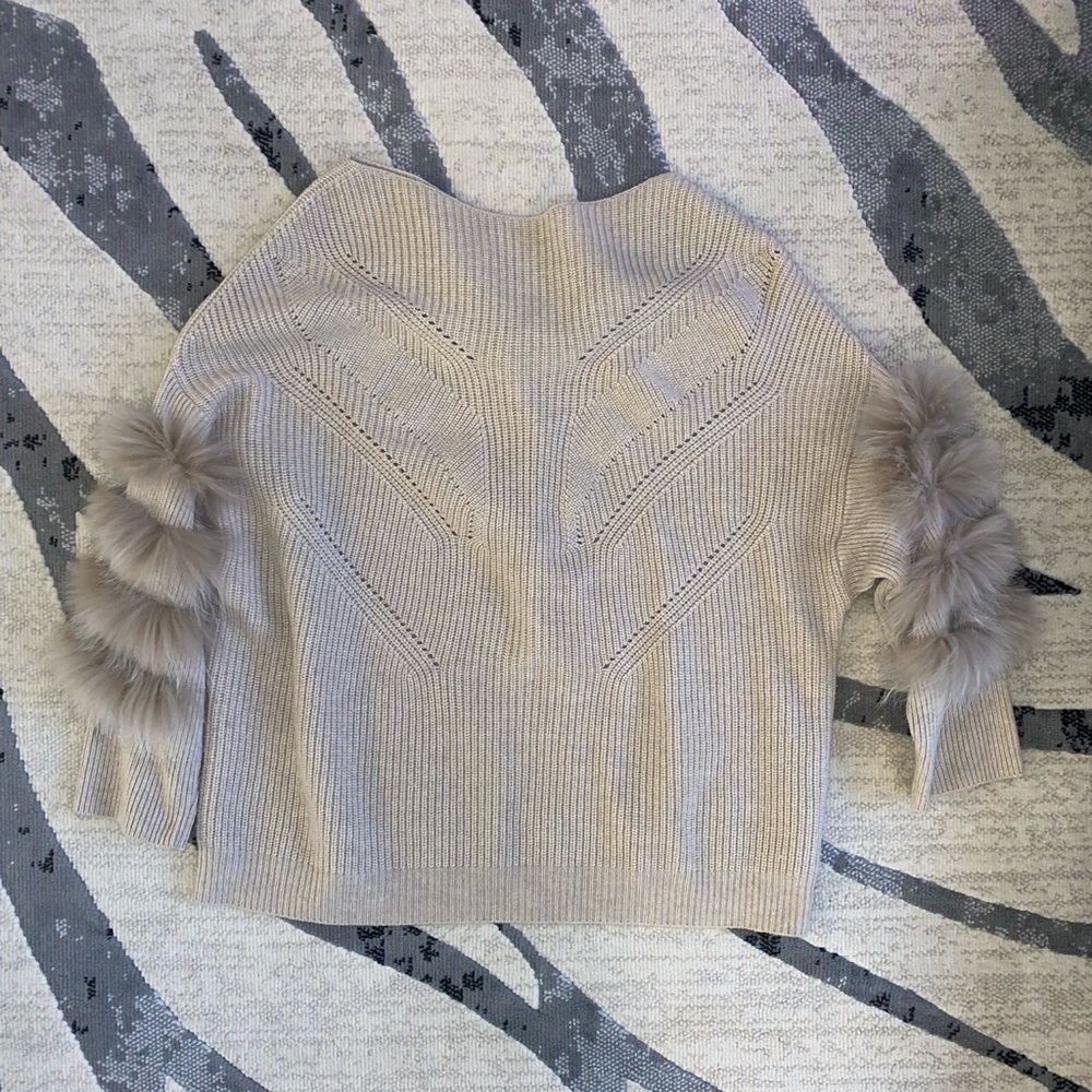 Knit sweater with real fur sleeves
